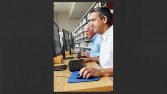 men working at computers in libraries