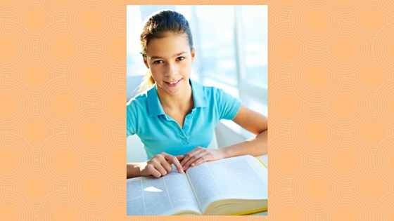 girl using large reference book