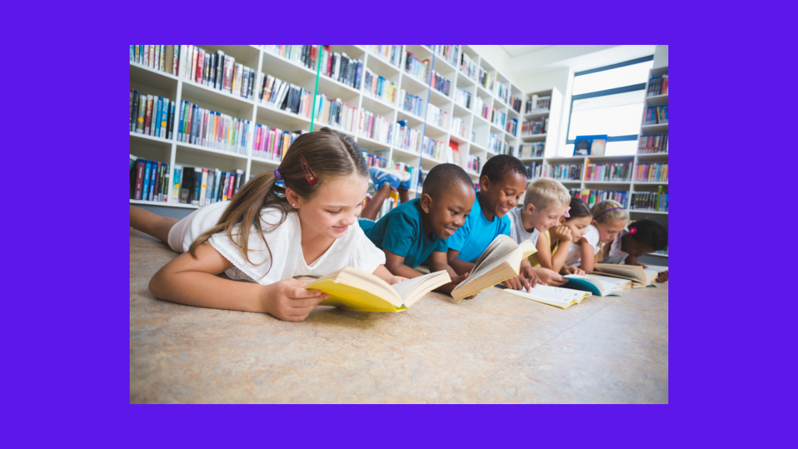 six kids reading on the floor of a library