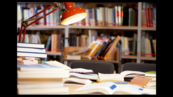 desk in front of library shelves