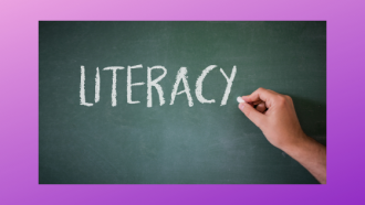 chalkboard with hand writing the word literacy