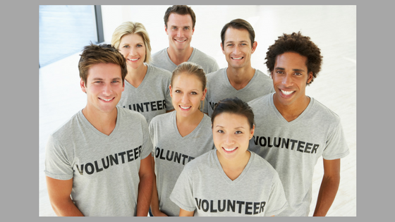 group of young people with 'volunteer' shirts on