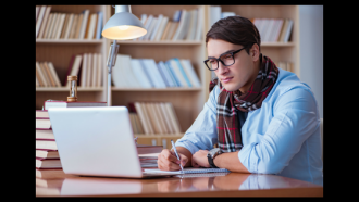 person at library working on computer